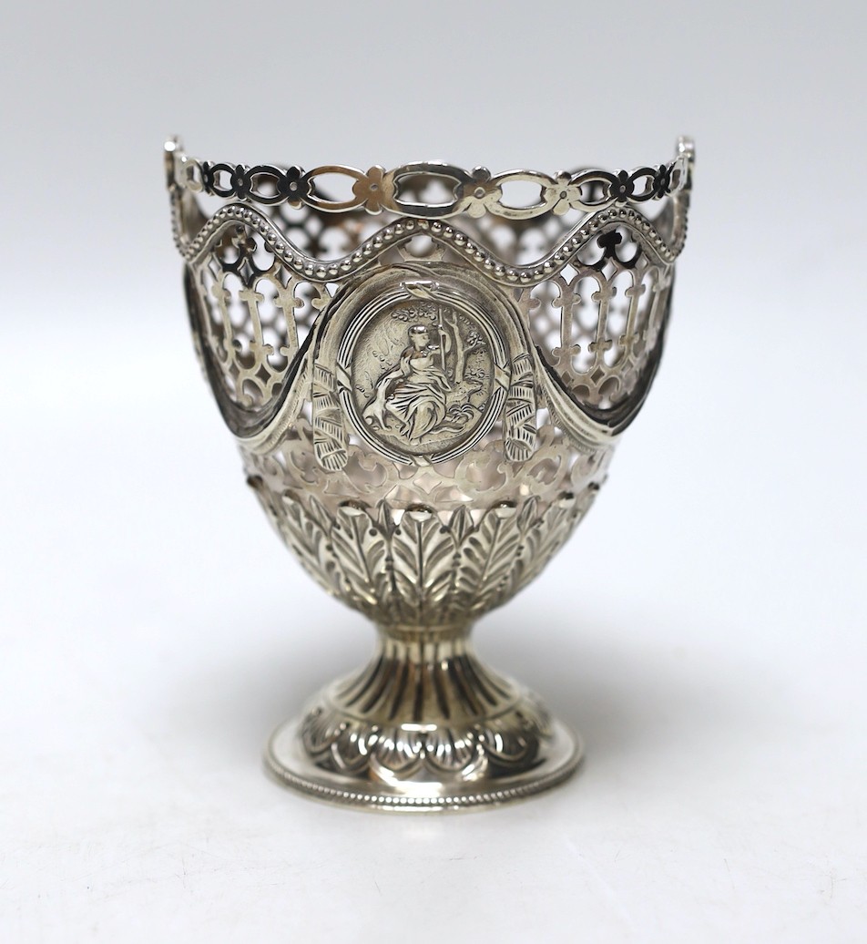 A George III pierced silver vase shaped sugar basket, lacking liner, London, 1775, height 12.6cm, 5.7oz.